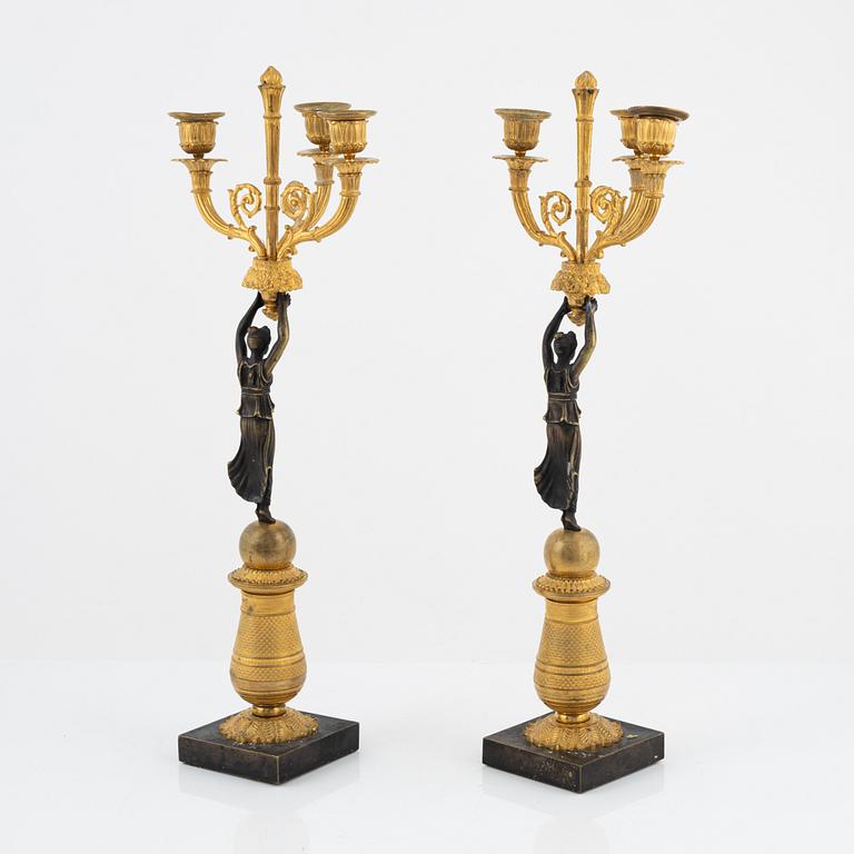 A pair of bronz empire style candelabras, 19th Century.