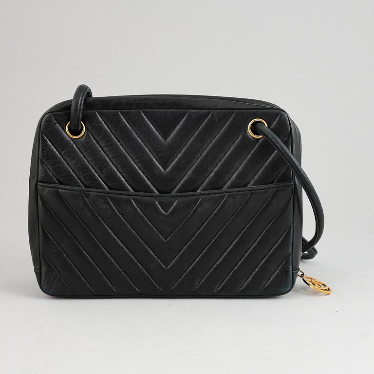 Chanel, a black leather handbag, 1980's.