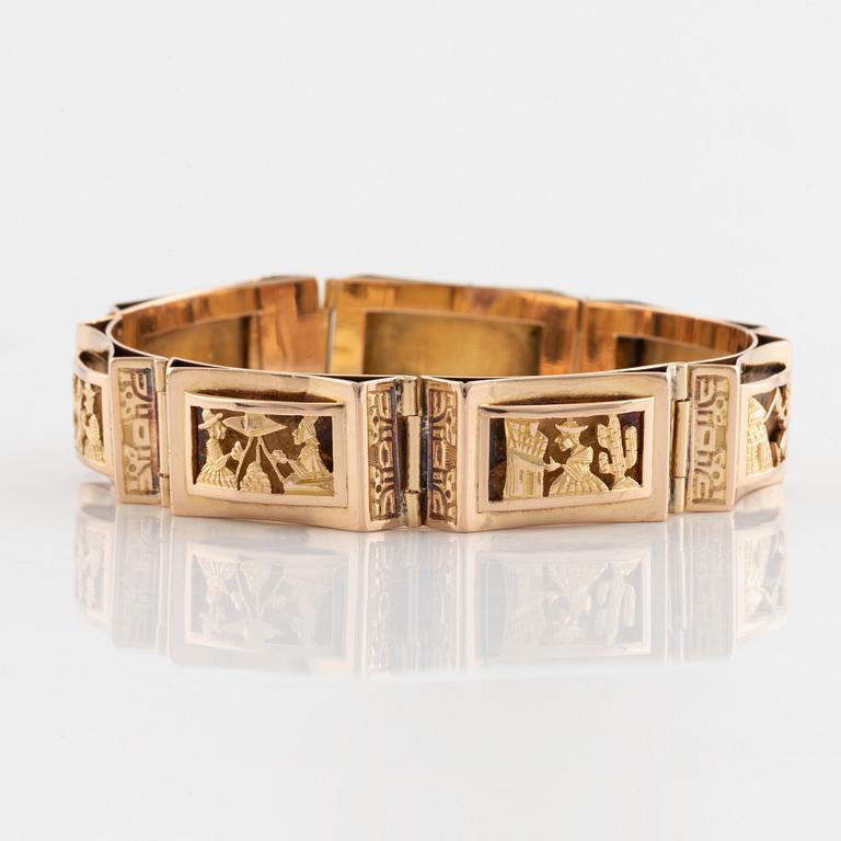 Armband, guld, paneler med figurmotiv.