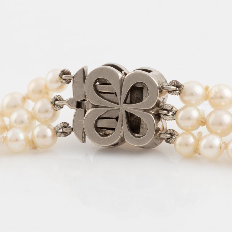 Three strand calibrated cultured pearl necklace, clasp with pearl and rose cut diamonds.