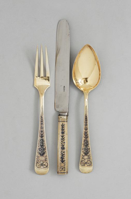 A SET OF THREE RUSSIAN SILVER-GILT AND NIELLO CUTLERY, Moscow 1824.