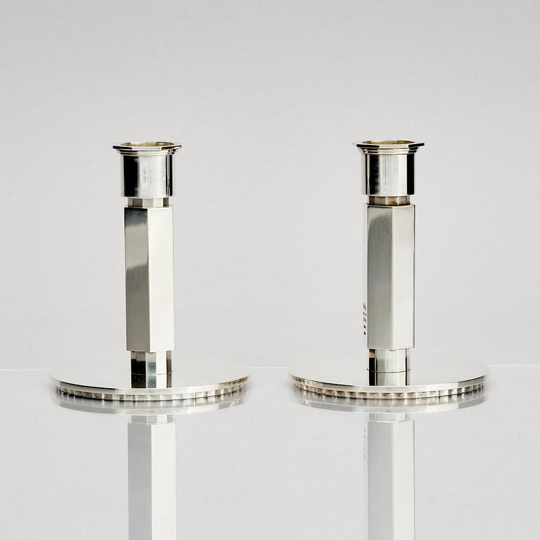 Wiwen Nilsson, a pair of sterling silver candlesticks, Lund, Sweden 11957 and 1960.