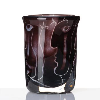 Ingeborg Lundin, an 'ariel' burgundy coloured glass vase decorated with faces, Orrefors Sweden 1972.