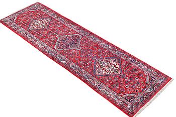 A Hosseinabad runner carpet, c. 304 x 84 cm.