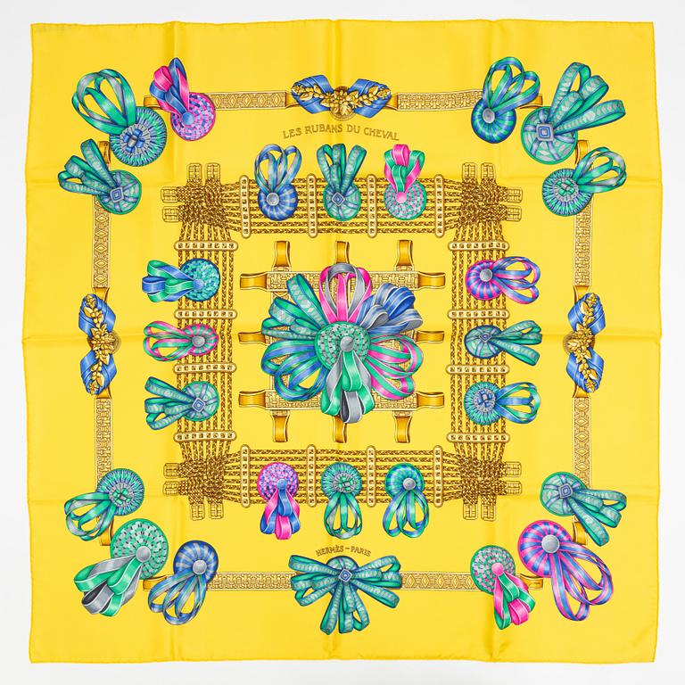 Hermès, a 'Les Rubans du Cheval' silk scarf.