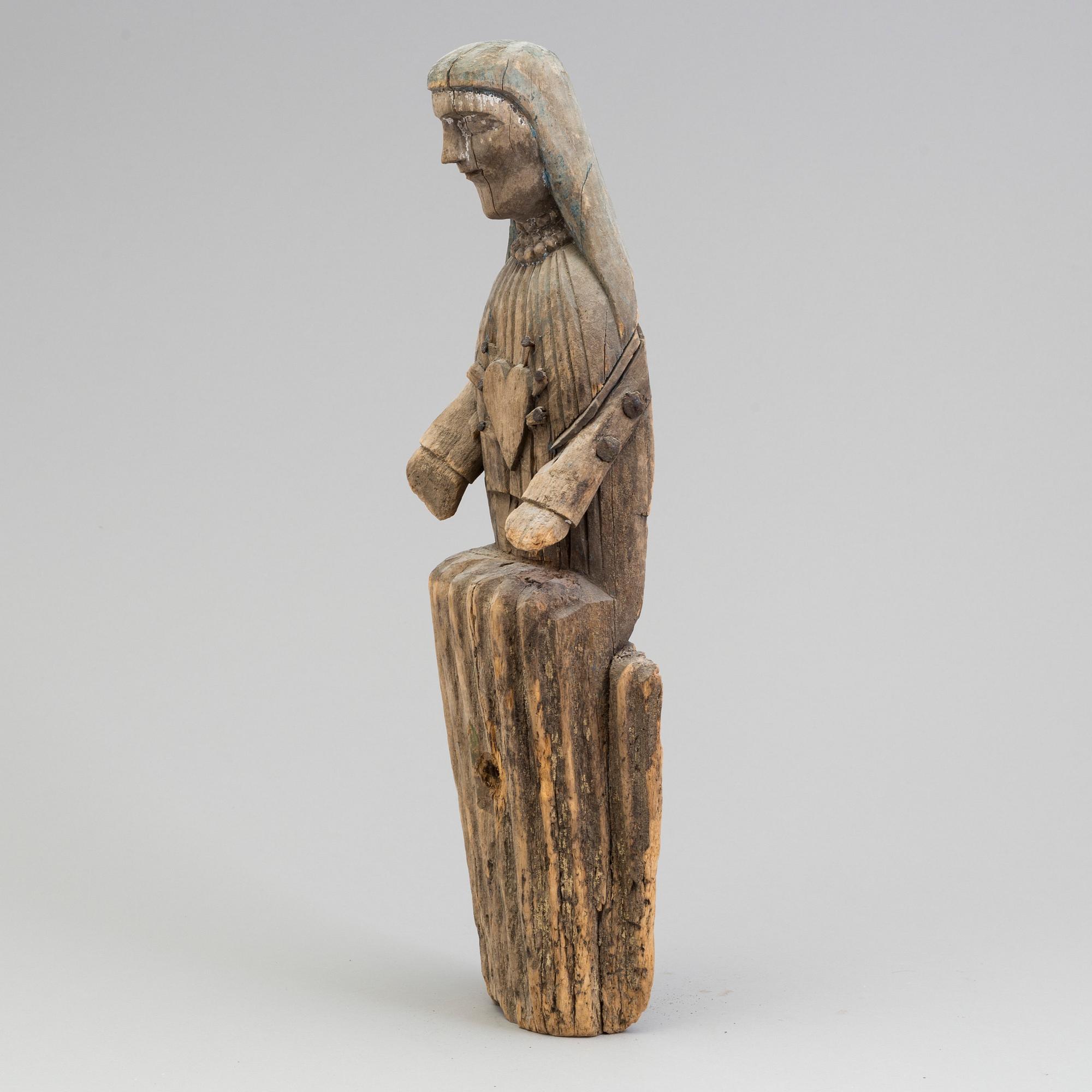 A wooden 19th century sculpture.