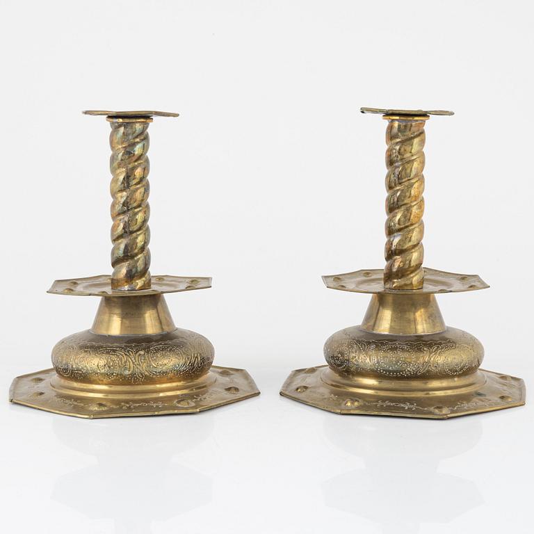 A pair of brass candlesticks, Baroque style, circa 1900.