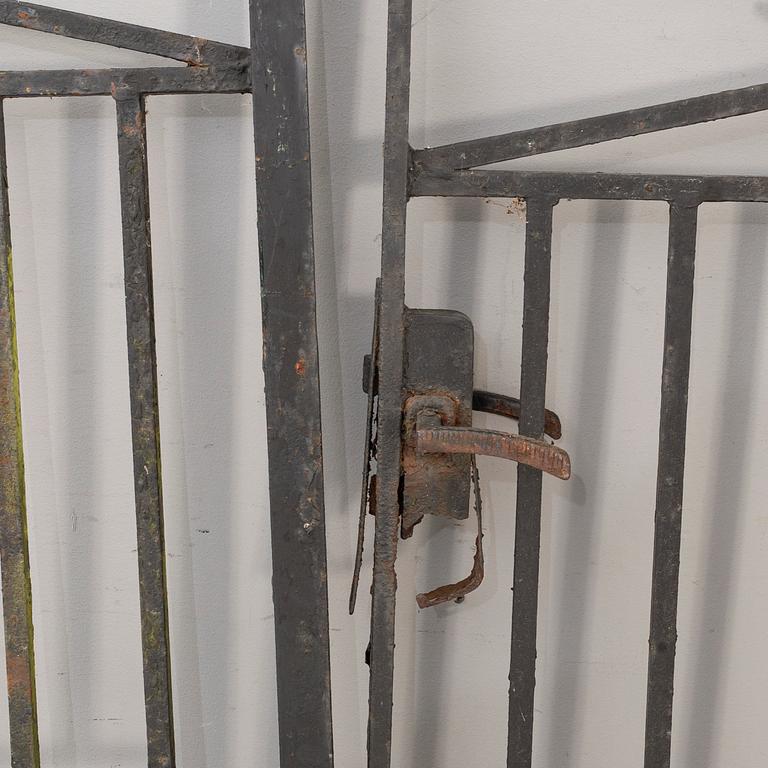 A pair of cast iron gates from the first half of the 20th Century.