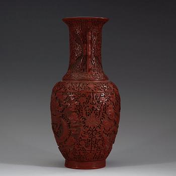 A lacquer vase, late Qing Dynasty (1644-1912) with Qianlong mark.