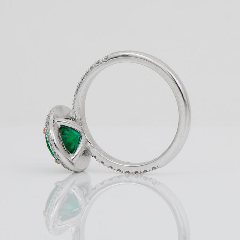 A 1.71-ct Zambian emerald (minor oil) and pavé-set diamond ring. Total carat weight of diamonds 0.65 cts.