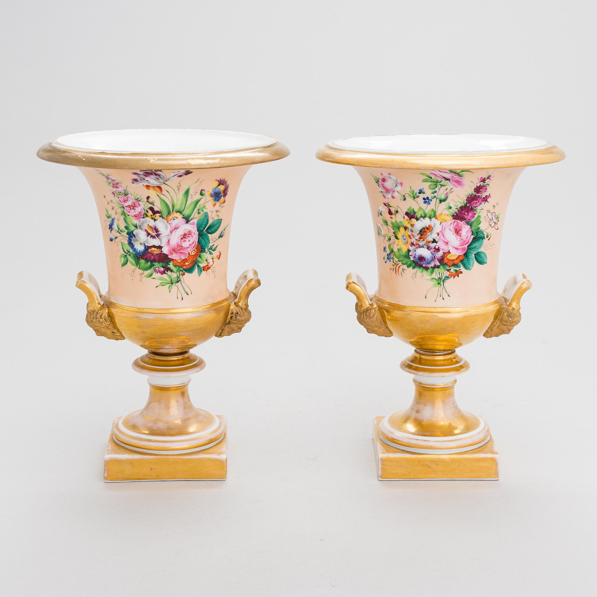 A pair of German porcelain urns from around the mid-19th century.