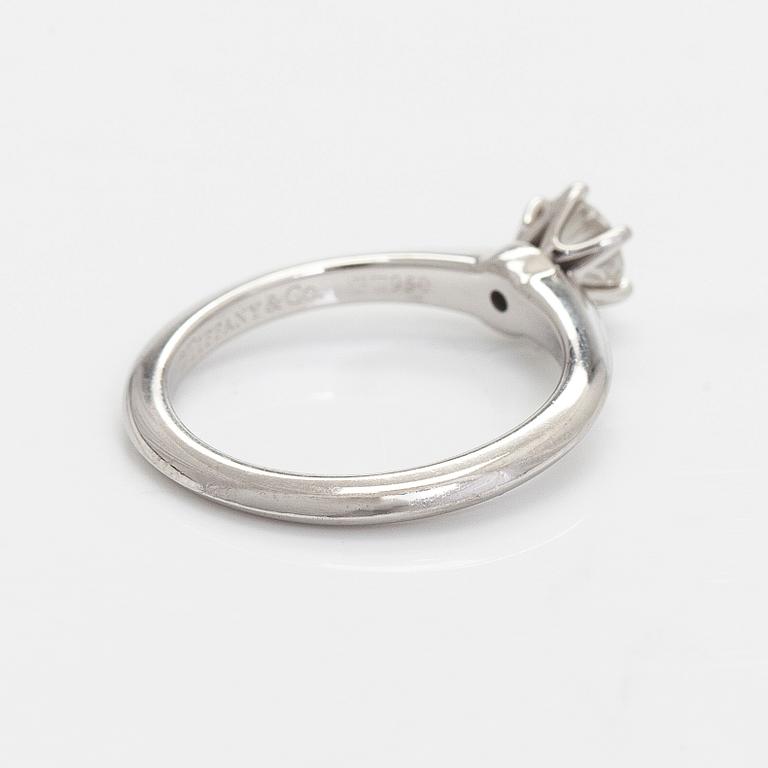 Tiffany & Co, a platinum solitaire ring with a brilliant-cut diamond.