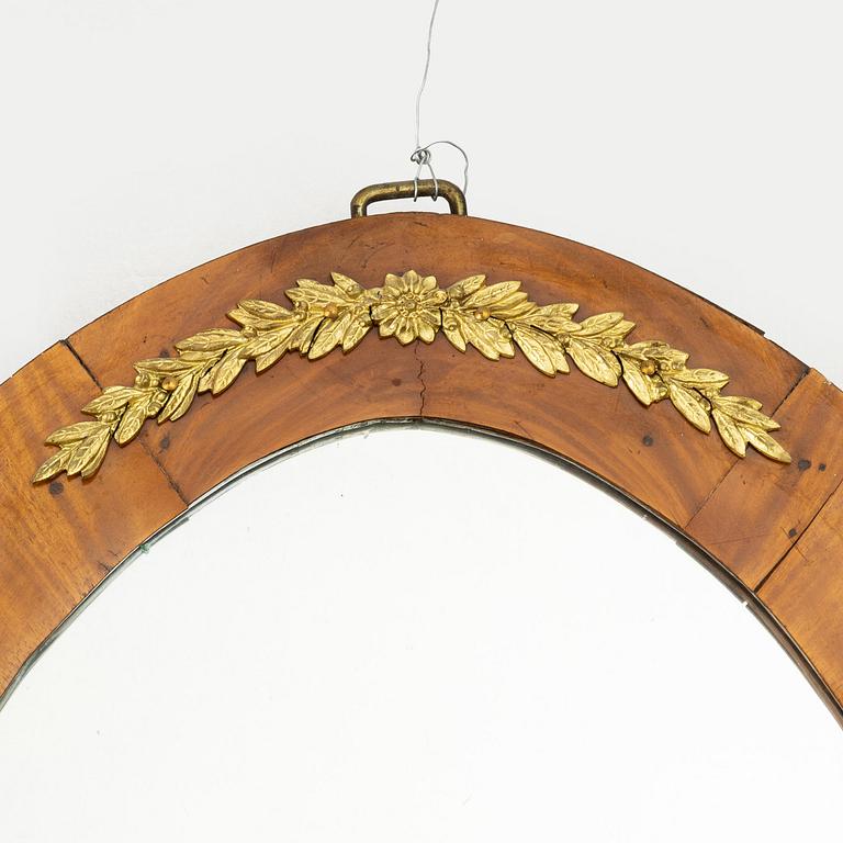 A pair of Swedish Empire mirror sconces, first half of the 19th century.