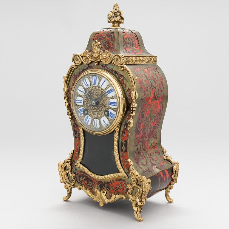 A French boulle style mantel clock, late 19th Century.