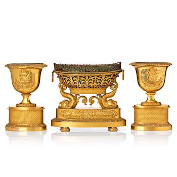 117A. A set of three French Empire early 19th century gilt bronze centre pieces.