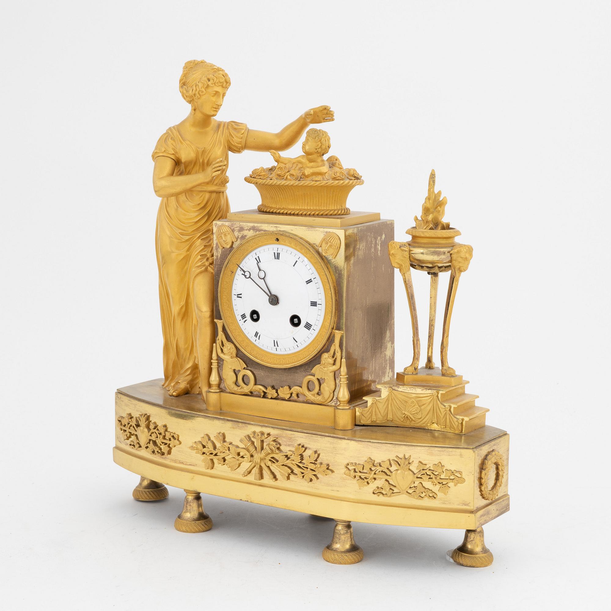 A French Empire gilt bronze mantle clock, early 20th Century.
