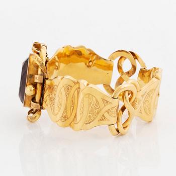 Armband 18K guld med en fasetteslipad ametist, G Möllenborg.