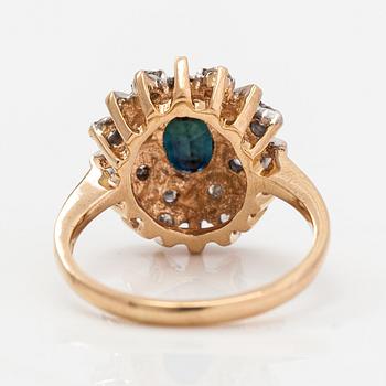 A 14K gold ring with diamonds ca. 0.40 ct in total and a sapphire. Finland 1995.