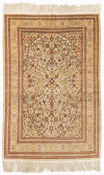 A Hereke silk rug, c. 130 x 87 cm.