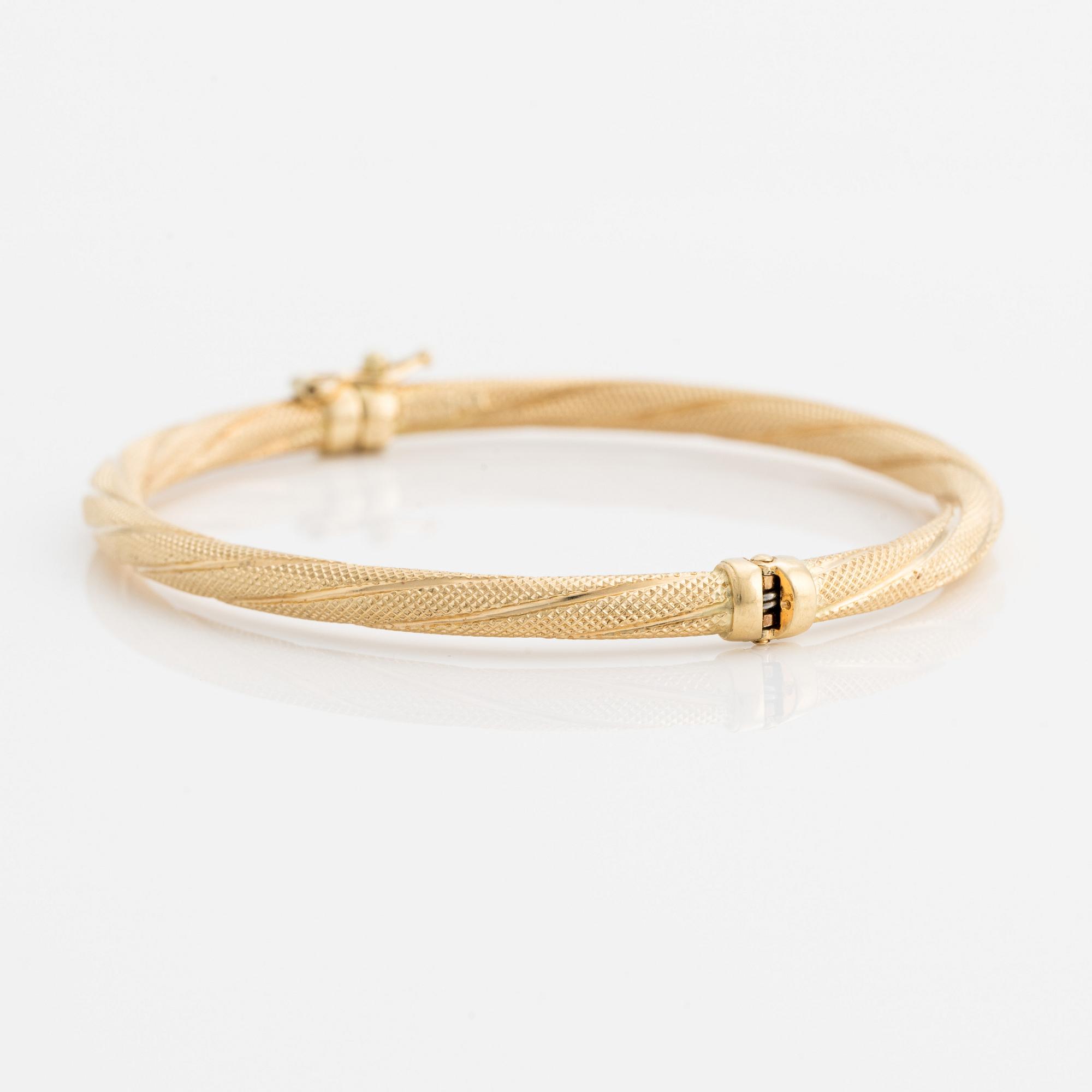 Armring, 18K guld, vriden dekor, Uno A Erre, Italien.