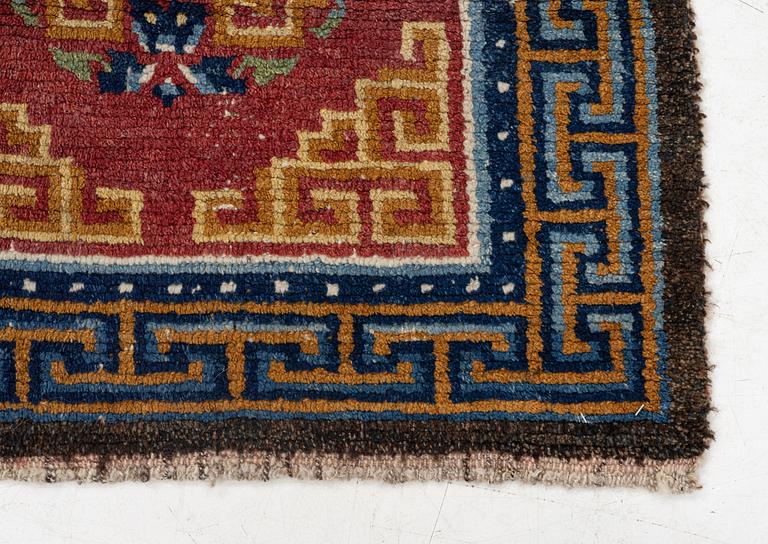 An antique Tibet 'Khaden' rug, c 135 x 70 cm.