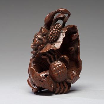 A bamboo carving of a crab and lotus, late Qing dynasty.