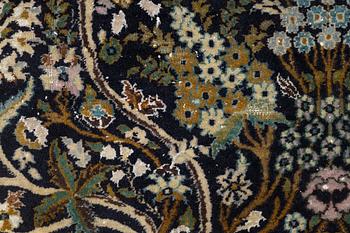 A figural Quum carpet, c. 179 x 125 cm.