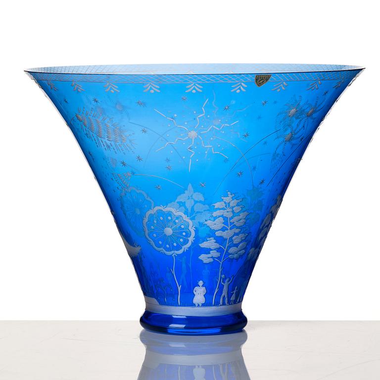 Edward Hald, an engraved blue glass "Fyrverkeriskålen" glass bowl, Orrefors 1957, engraved by Karl Rössler.