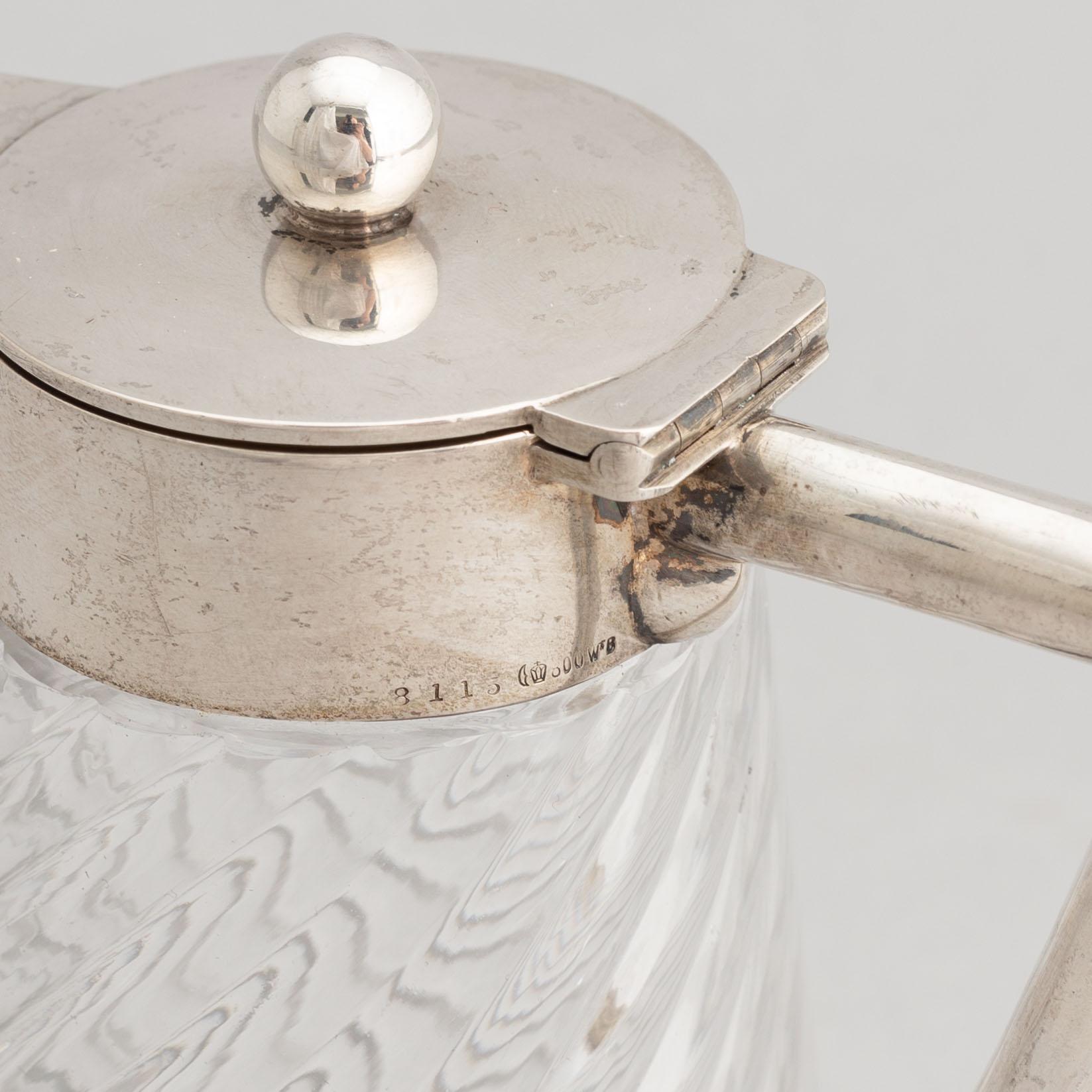 A German glass and silver carafe, mark of Wilhelm Binder, Bremen, Schwäbisch Gmünd, circa 1900.