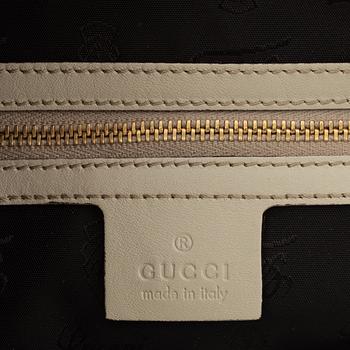 Gucci, a 'Pop Bamboo' python bag.