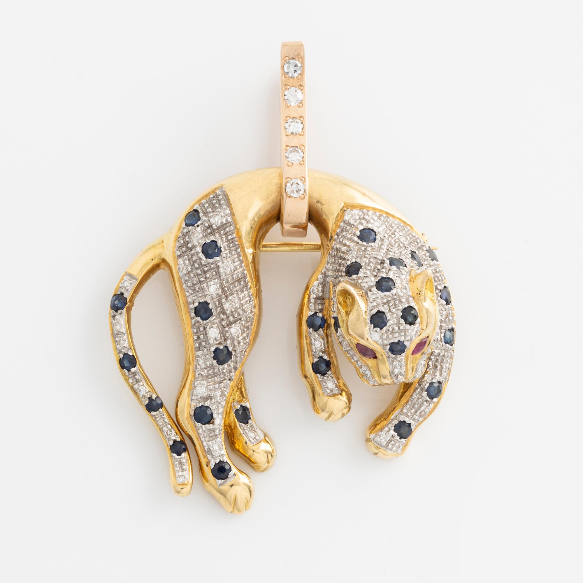 Brooch/pendant in the shape of a feline animal, gold with sapphires, rubies, and brilliant- and octagon-cut diamonds.