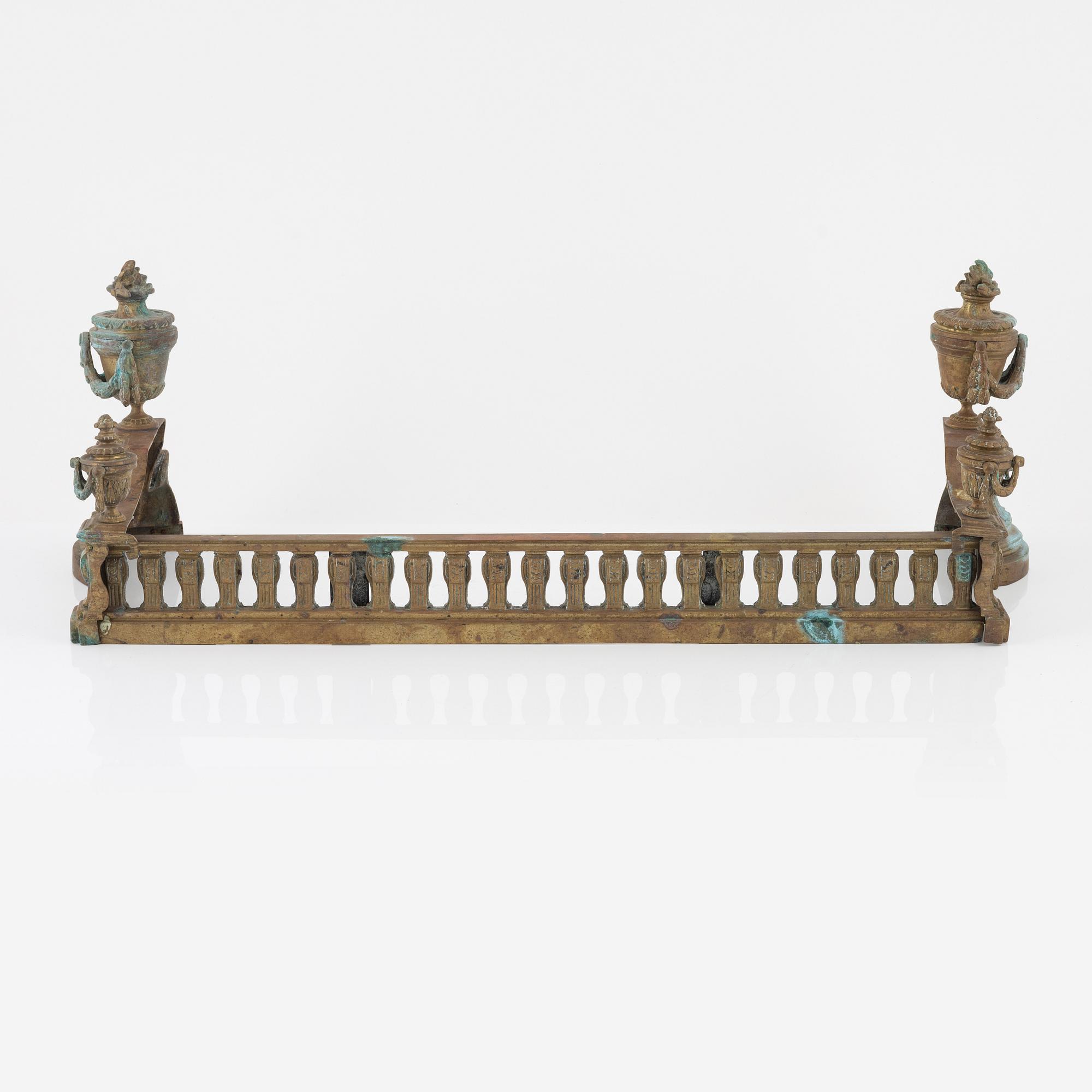 A Louis XVI style bronze grate, 19th Century.