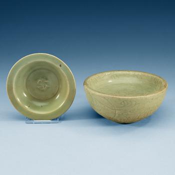 A celadon glazed double fish dish, and a hot water dish, Yuan dynasty (1271-1368).