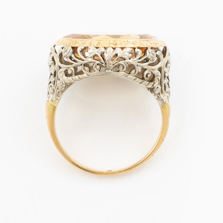 Gold ring with synthetic yellow sapphire.