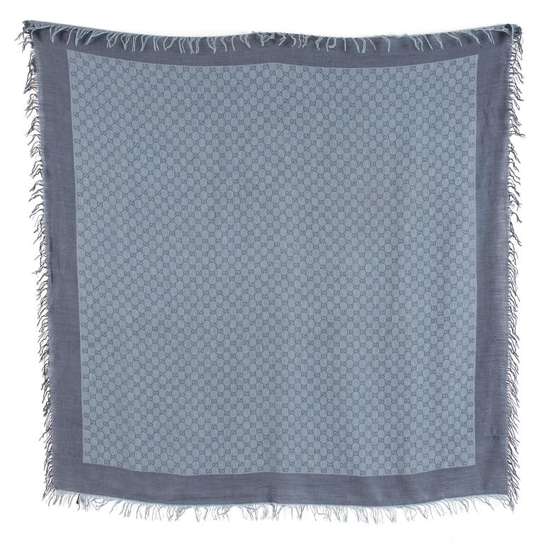 A shawl by Gucci.