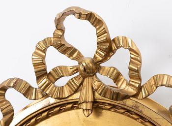 A Gustavian style mirror, early 20th Century.