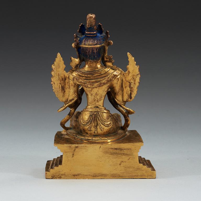 A Sino-Tibetan gilt bronze figure of Maitreya.