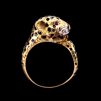 A RING shaped like a leopard with enamel, rubies and brilliant cut diamonds.