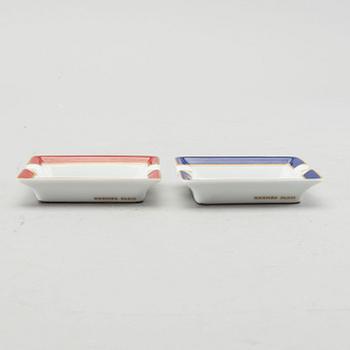 HERMÈS, a pair of porcelain ashtrays.