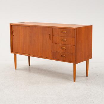 A 1950's teak veneered sideboard.
