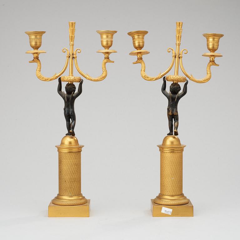 A pair of French Empire early 19th century two-light candelabra.