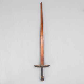 A 20th century wood pogo stick.