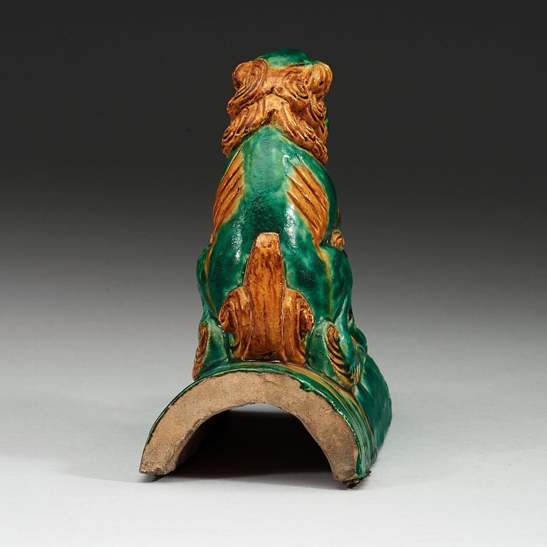 A sancai glazed roof tile figure of a mythological animal, Ming dynasty, 17th Century.