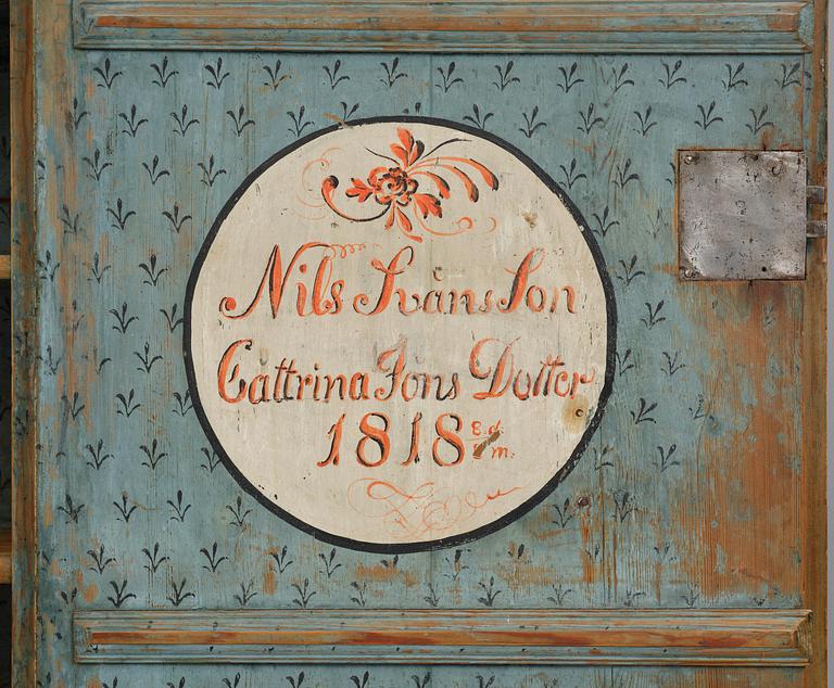 A polychrome-painted folk art cabinet from Värmland, Sweden, dated 1818.