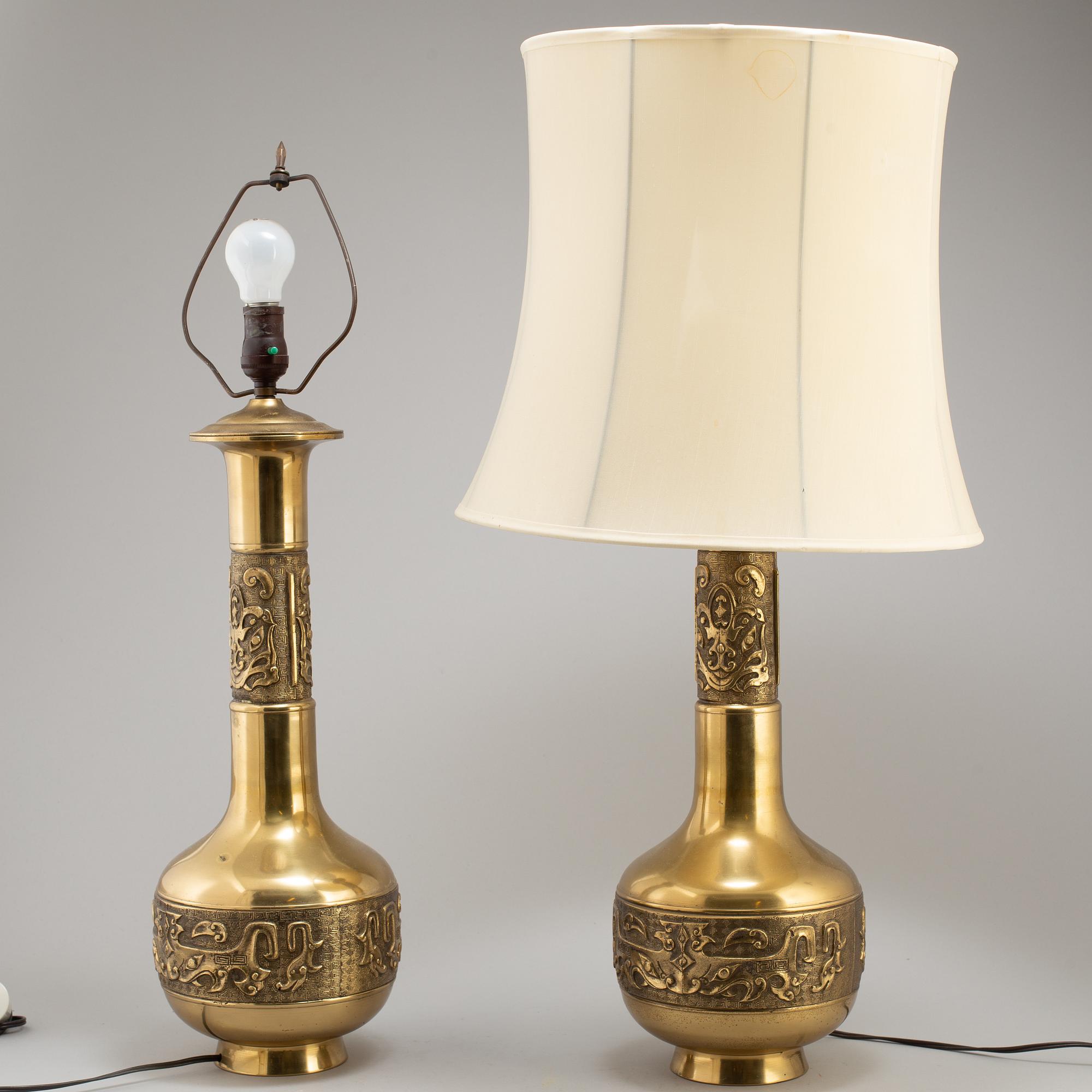 A pair of Chinese brass table lamps, 20th century.