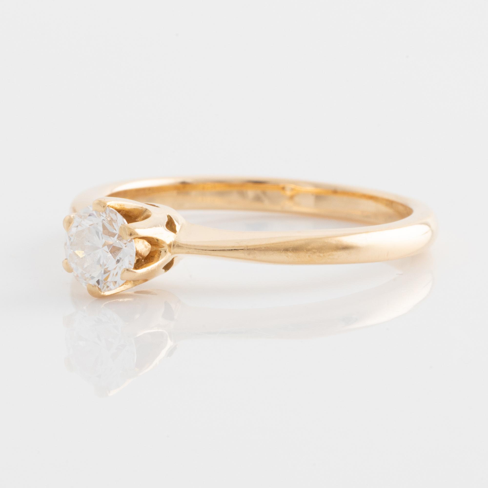 Ring guld 18K med en rund briljantslipad diamant.