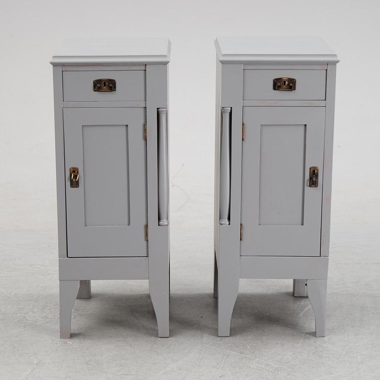 A pair of painted bedside tables stands. First half of the 20th century.