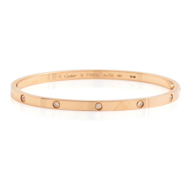 A Cartier "Love" bracelet small model in 18K rose gold with ten round brilliant-cut diamonds.