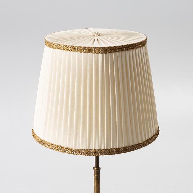 A brass floor lamp, 1940s.