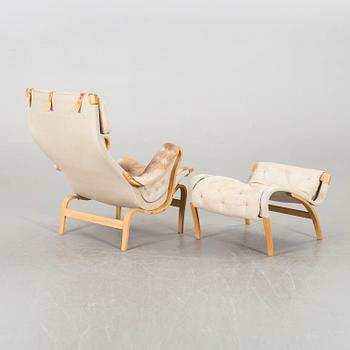 A BRUNO MATHSSON "PERNILLA" ARMCHAIR WITH STOOL.